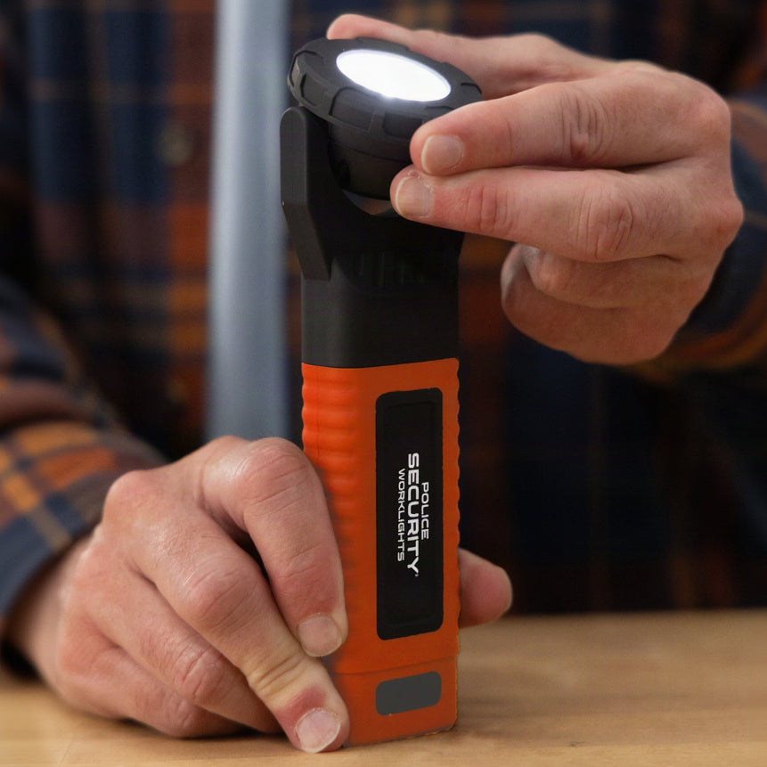 A user in a plaid shirt pivoting the lighting head of the Police Security Power Pro work light