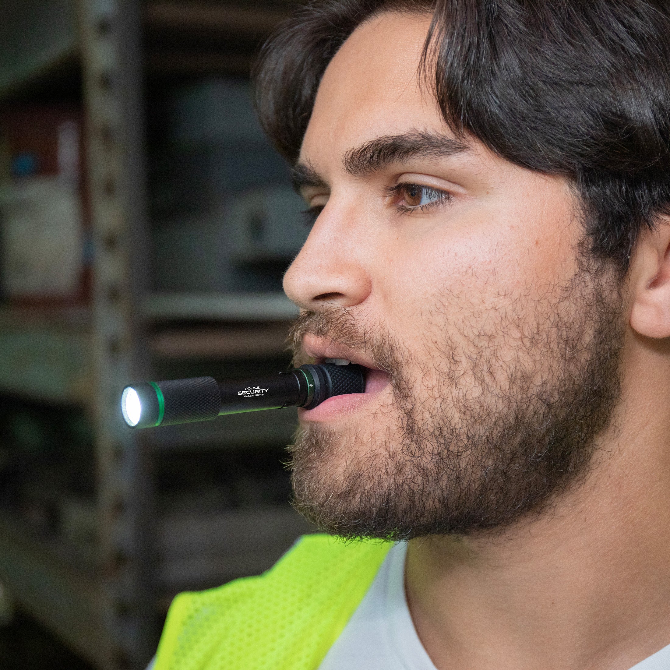 An image of a man with the AURA-RS 260 Lumen Rechargeable Penlight in his mouth