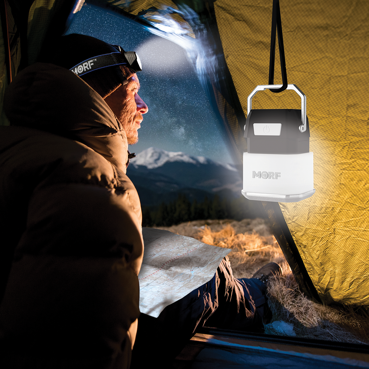 an image of a man in his tent with a MORF 650 lantern hanging from the top