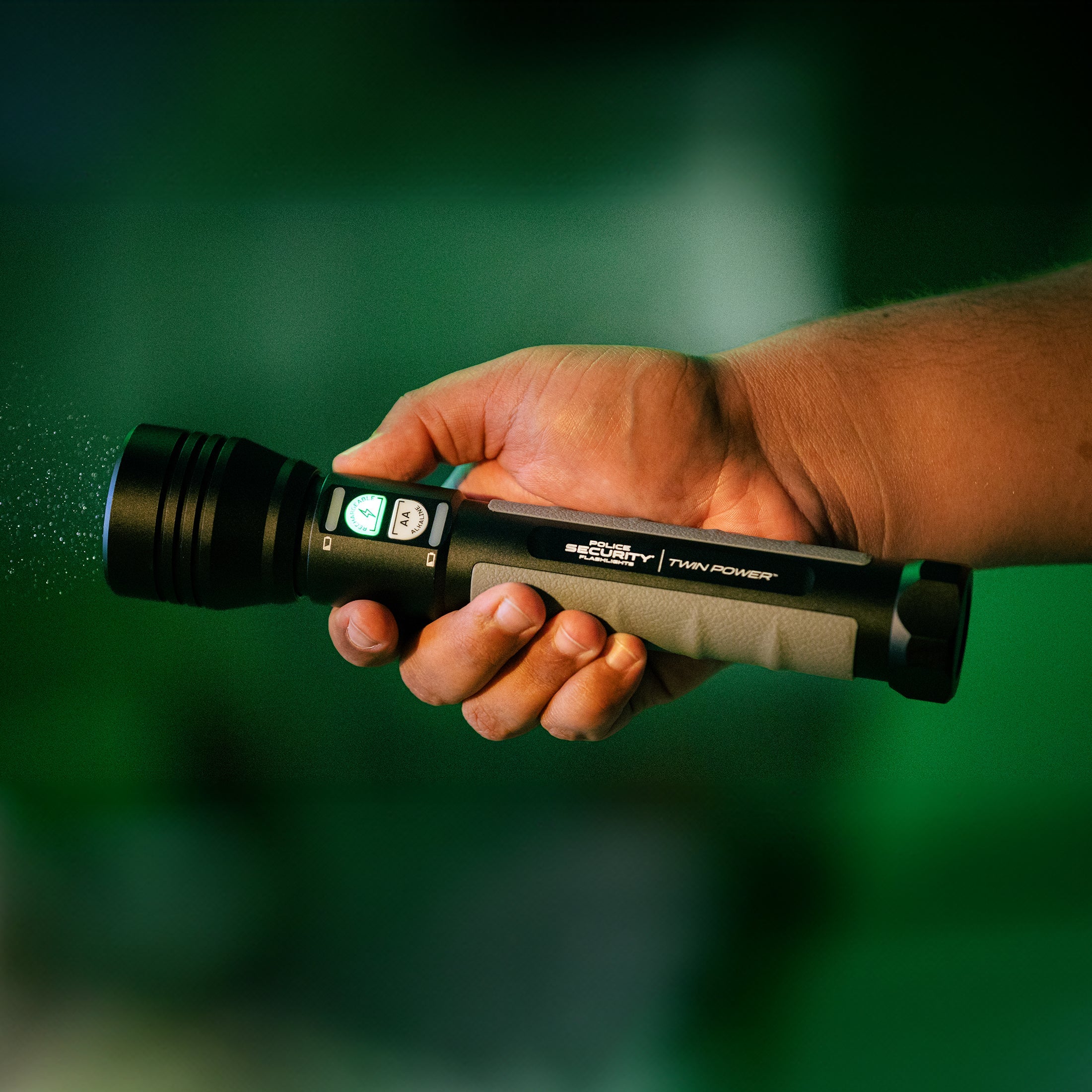 an image of a hand holding the Twin Power 2000 flashlight