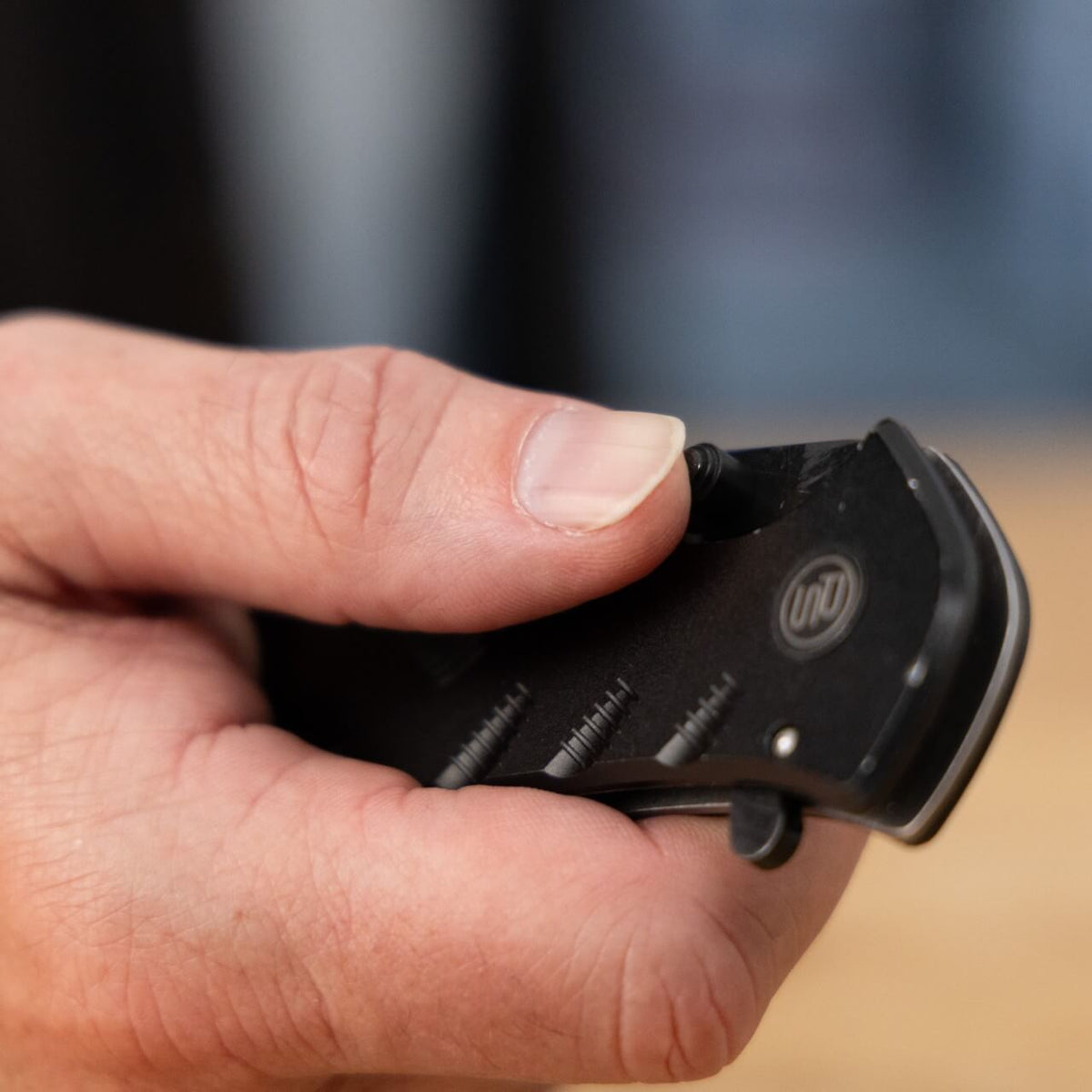 The Shield pocket knife from Police Security held in a man's hand
