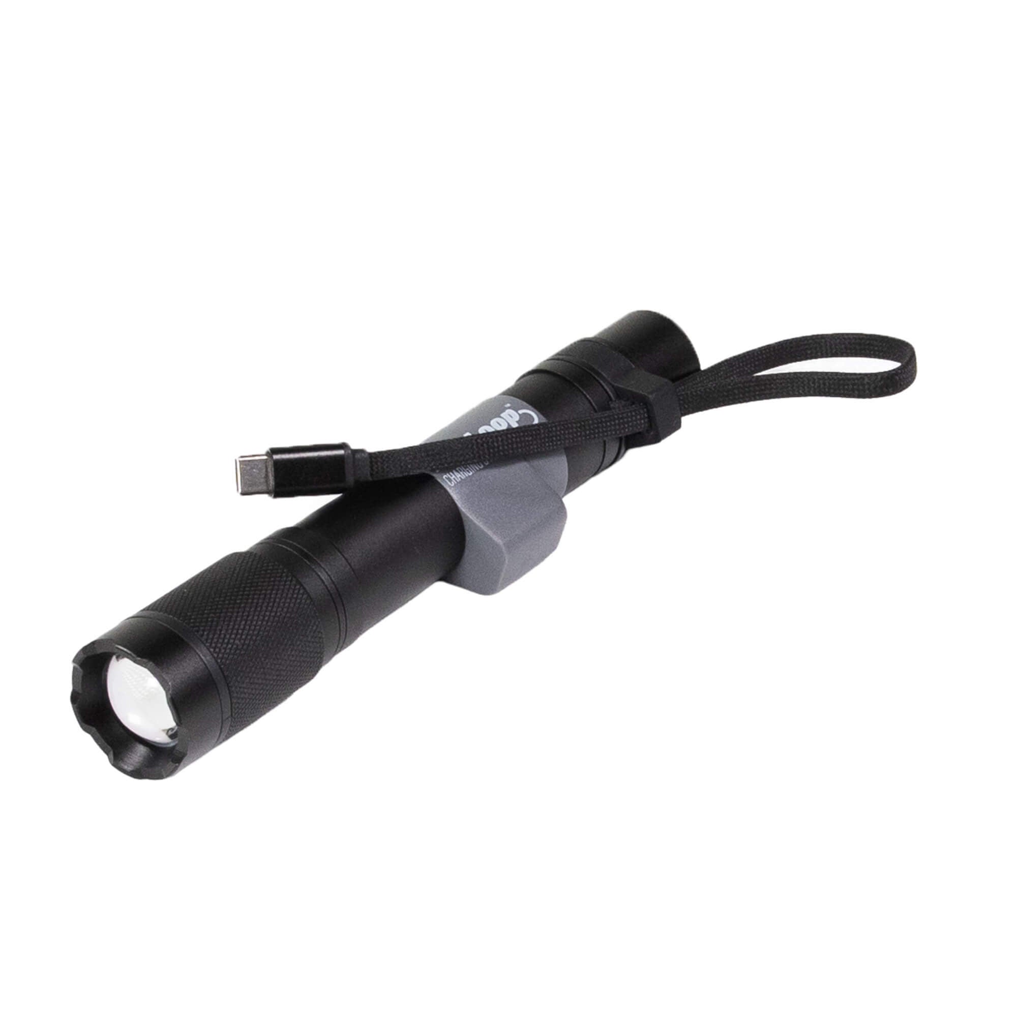 A black Flexloop Aura RX flashlight with a textured grip, a black wrist strap, and a built-in USB-C charging port, shown on a plain white background.