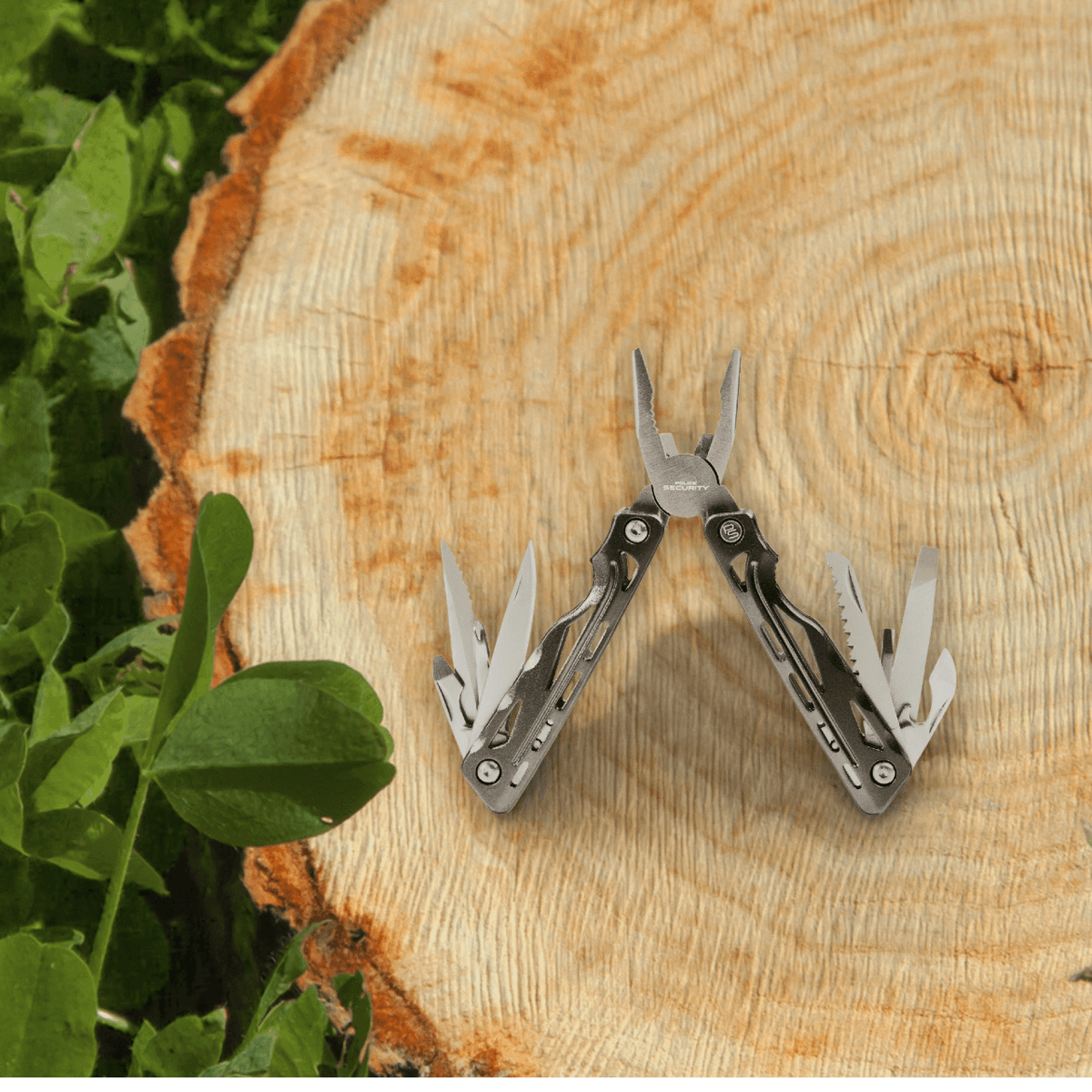 A plier pocket tool sitting on a stump with clovers next to it, with all tools spread open