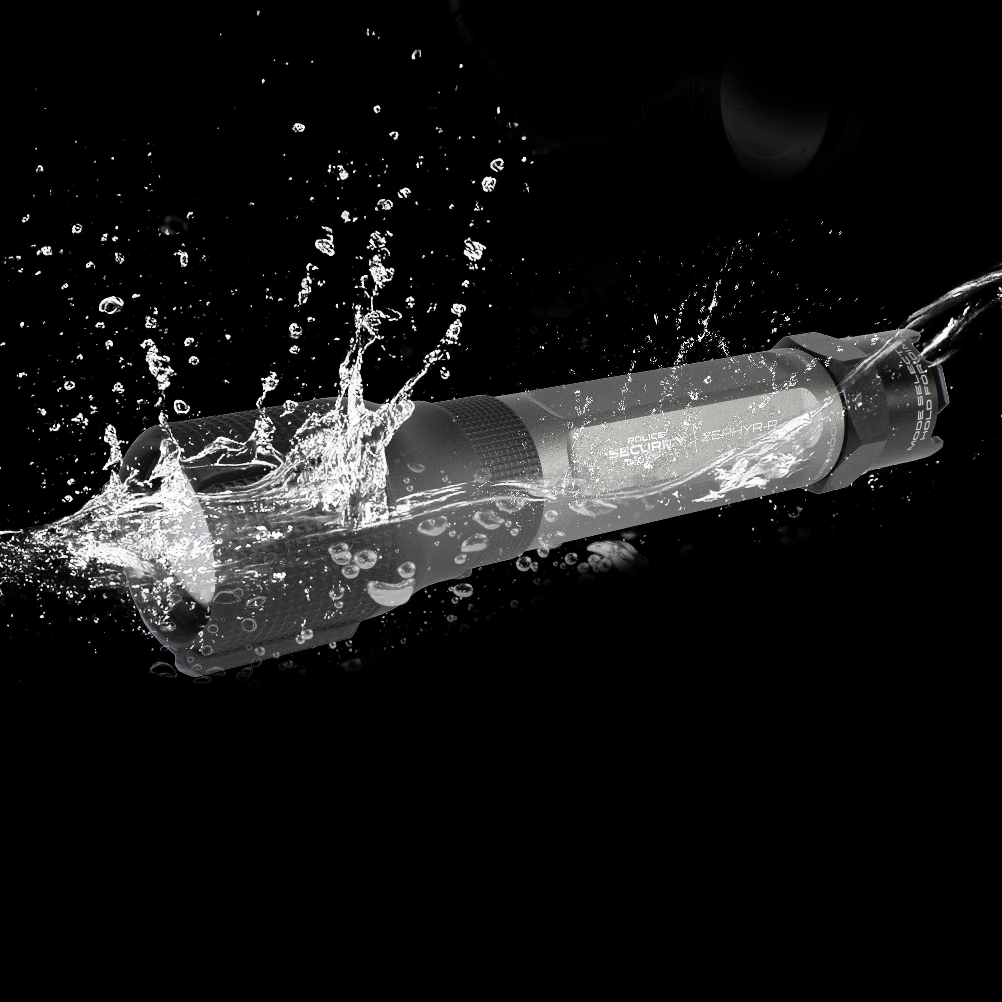 A Police Security Zephyr-R flashlight shown mid-splash with water droplets spraying around it on a solid black background.