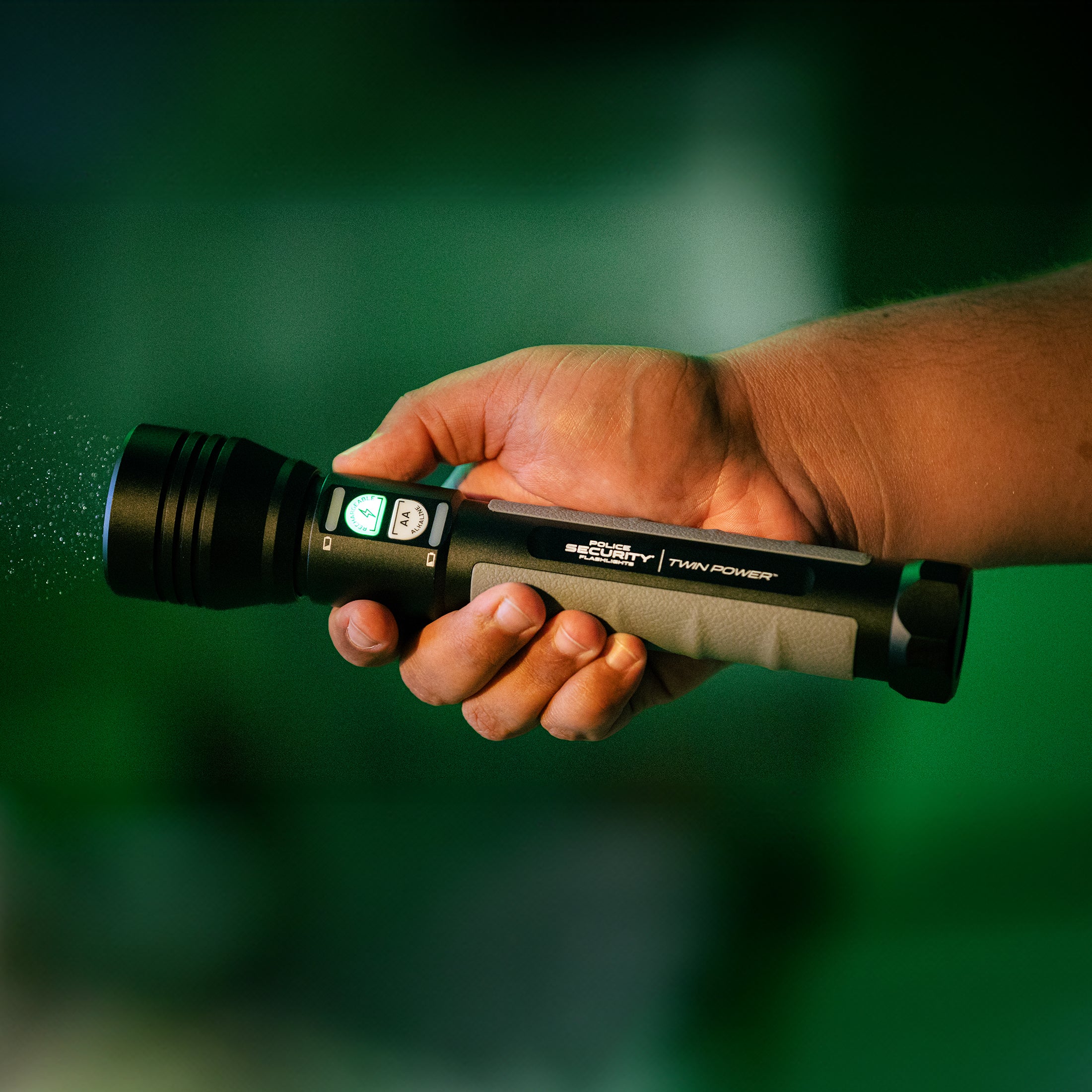 an image of a hand holding the Twin Power 2000 flashlight