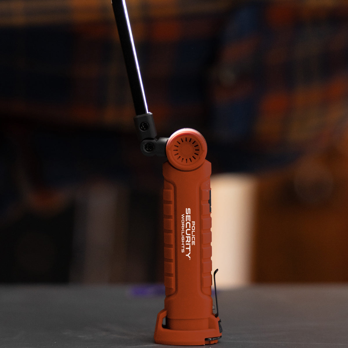 The Police Security ProFlex 400 work light on a table