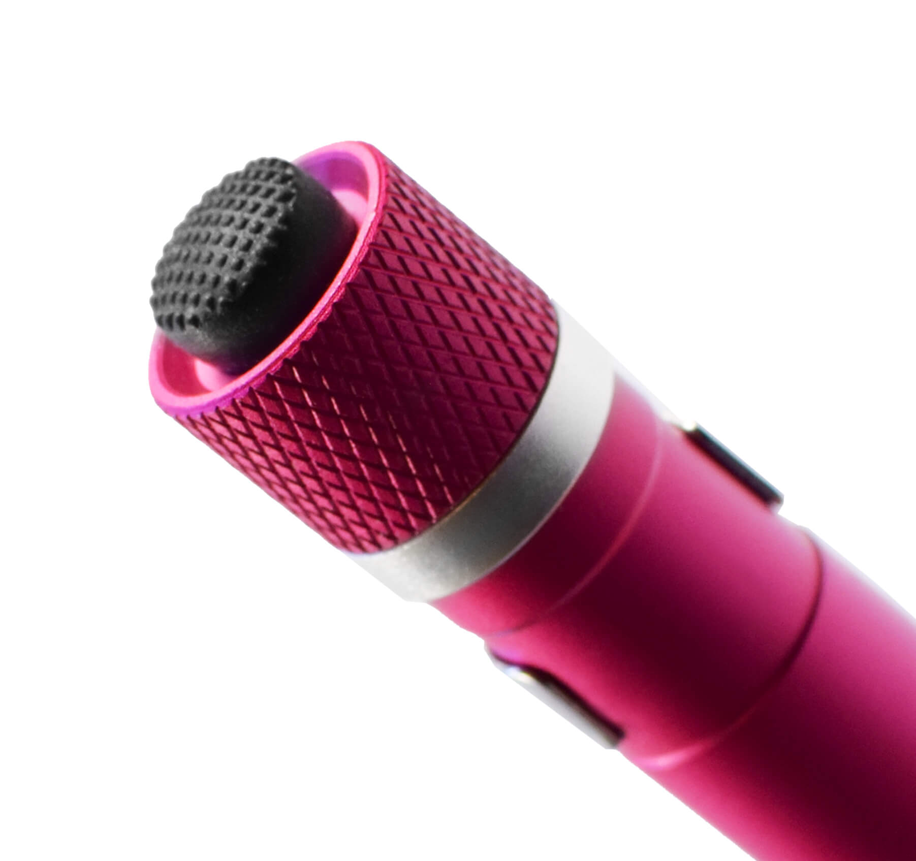 A close-up of a pink Aura penlight showing a textured pink grip, a silver metallic band, and a black rubber tail cap switch on a white background.