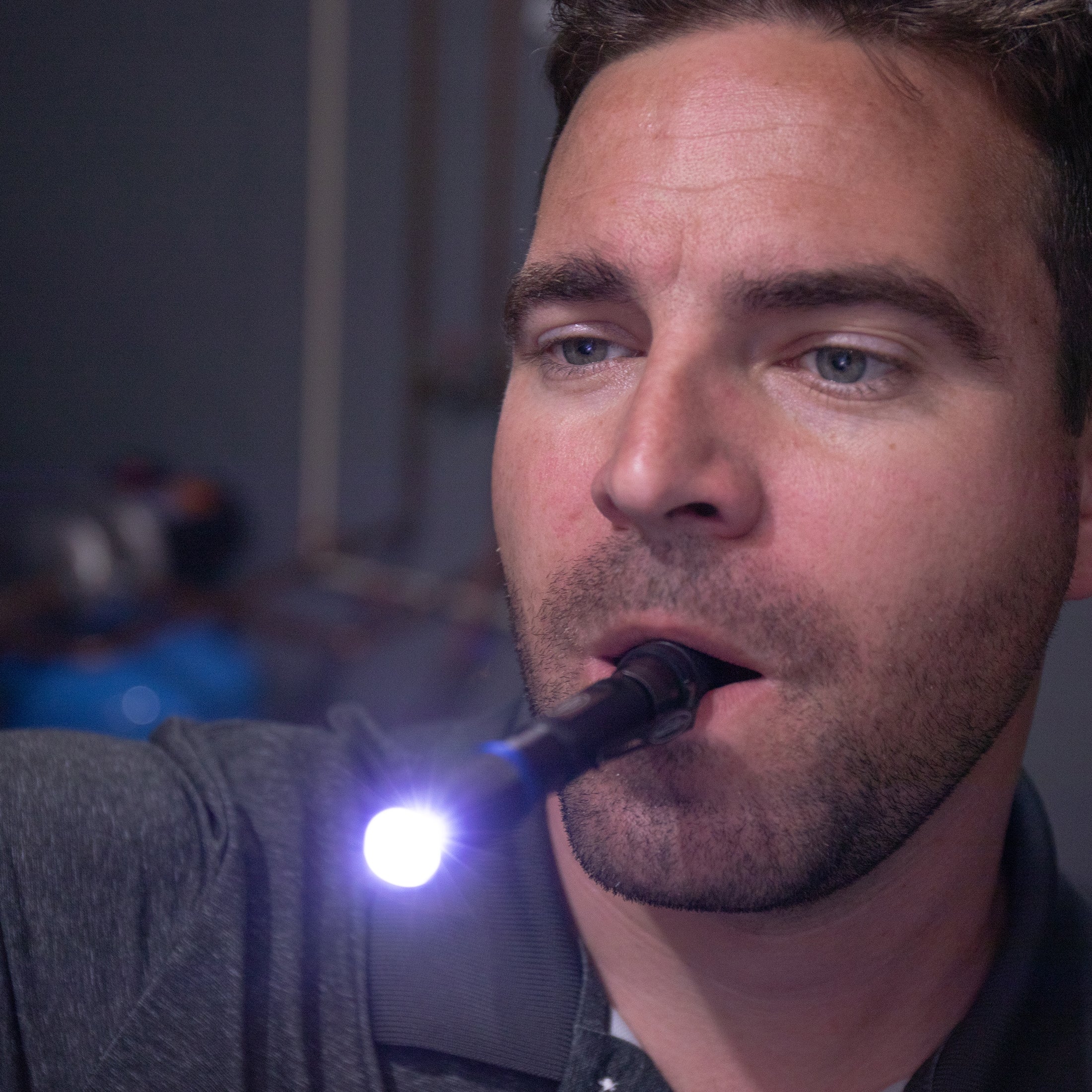 the Police Security Cavalier penlight held in the mouth