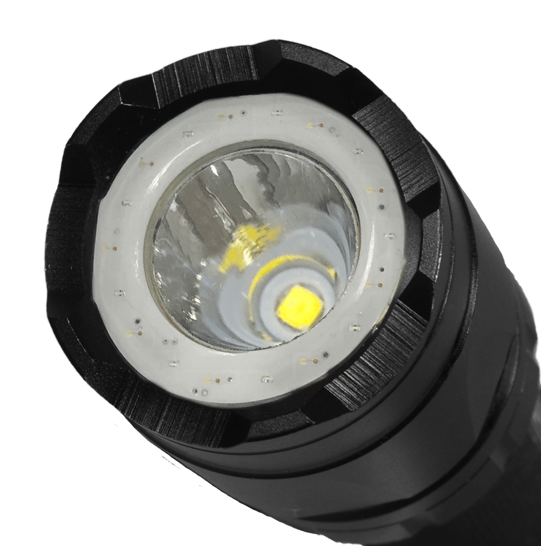 Close-up of a Trac Tact-R LED flashlight head showing the reflective lens, clear outer ring of UV lights, and yellow LED chip on a white background.