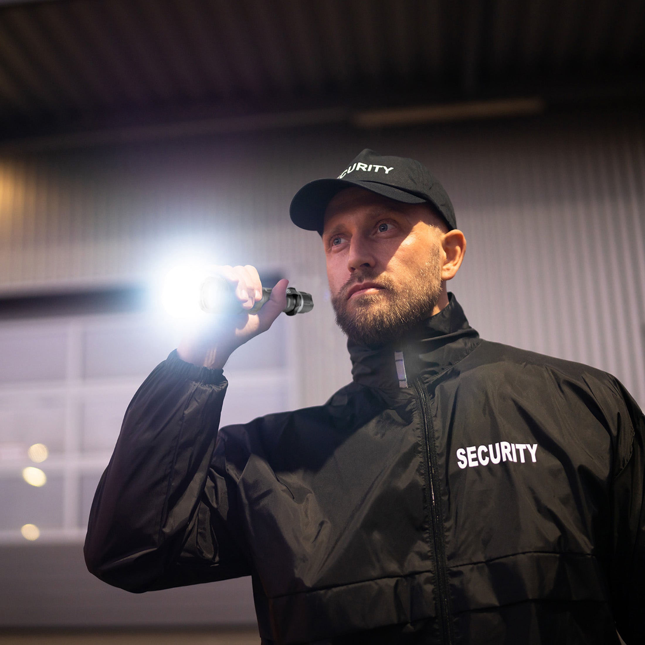 A security guard using the Police Security Trac Tact-R tactical flashlight
