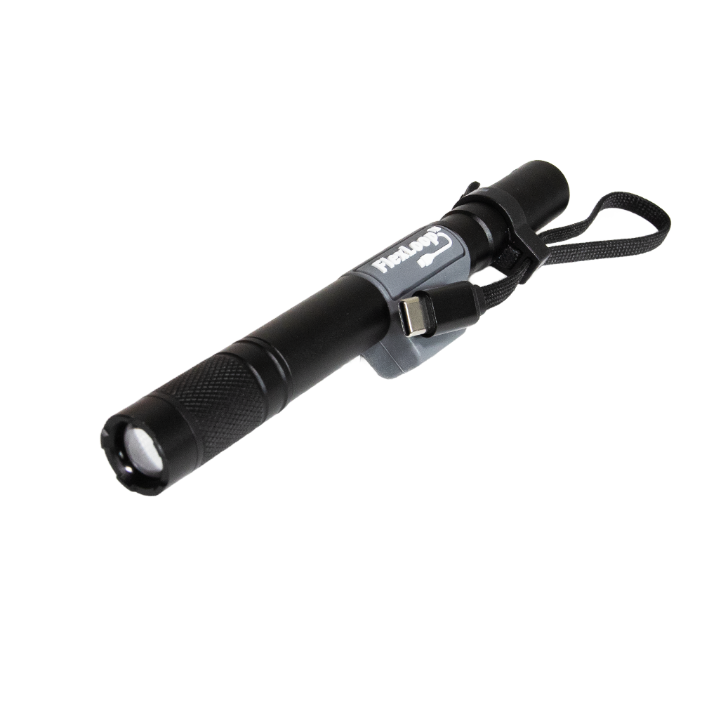 Black Flexloop Aura R flashlight with a strap on a white background